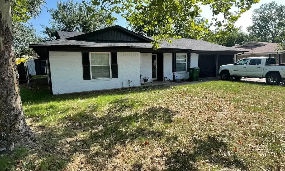 Professional roofing crew working on a residential roof in Mount Pleasant